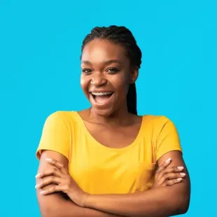Teenage girl with braces and a yellow shirt on