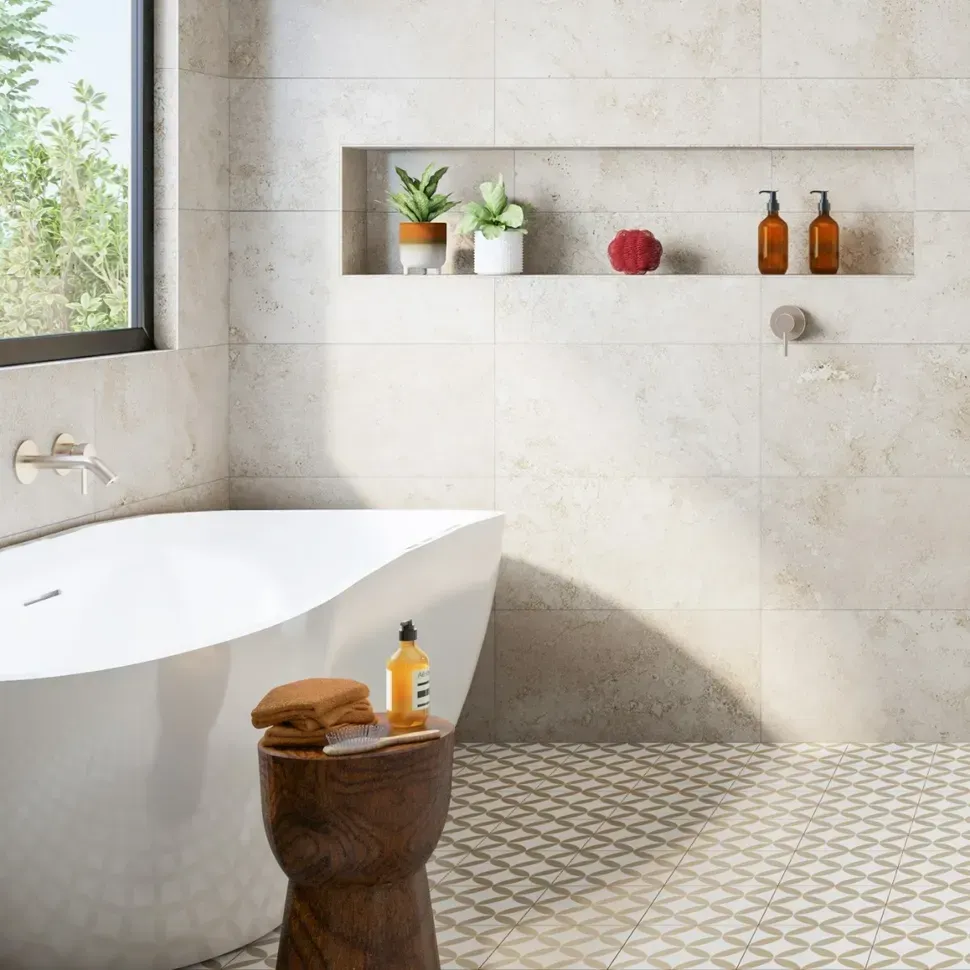 A Bathtub In A Bathroom With Patterned Tiles — Amber North Coast In Port Macquarie, NSW