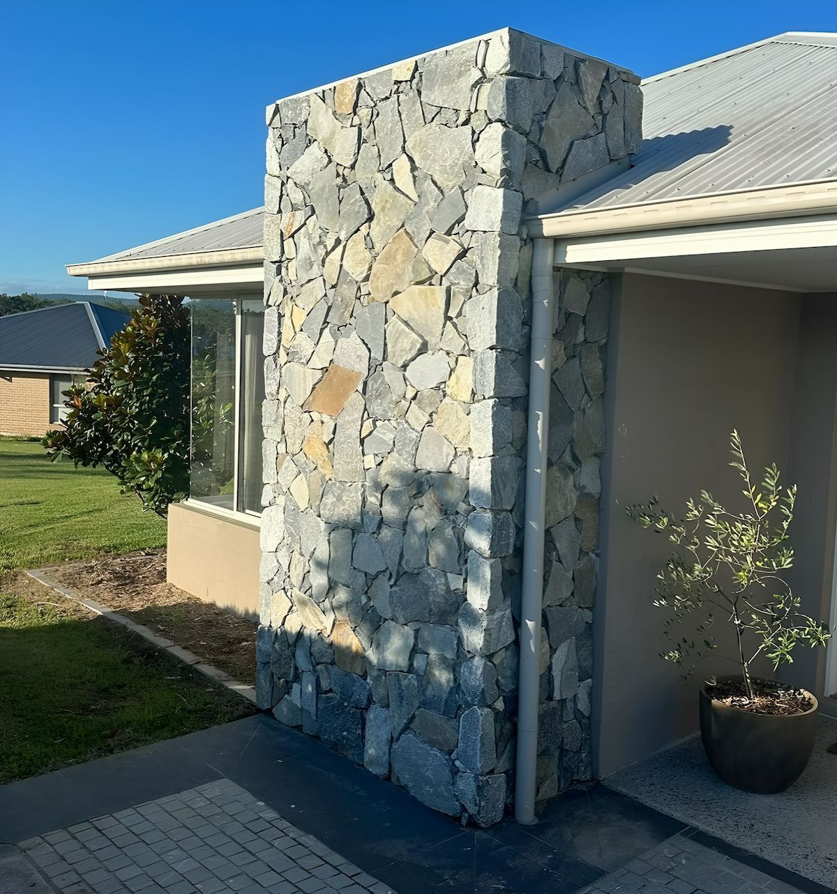 An Outside Of A House With Stone Cladding — Amber North Coast In Port Macquarie, NSW