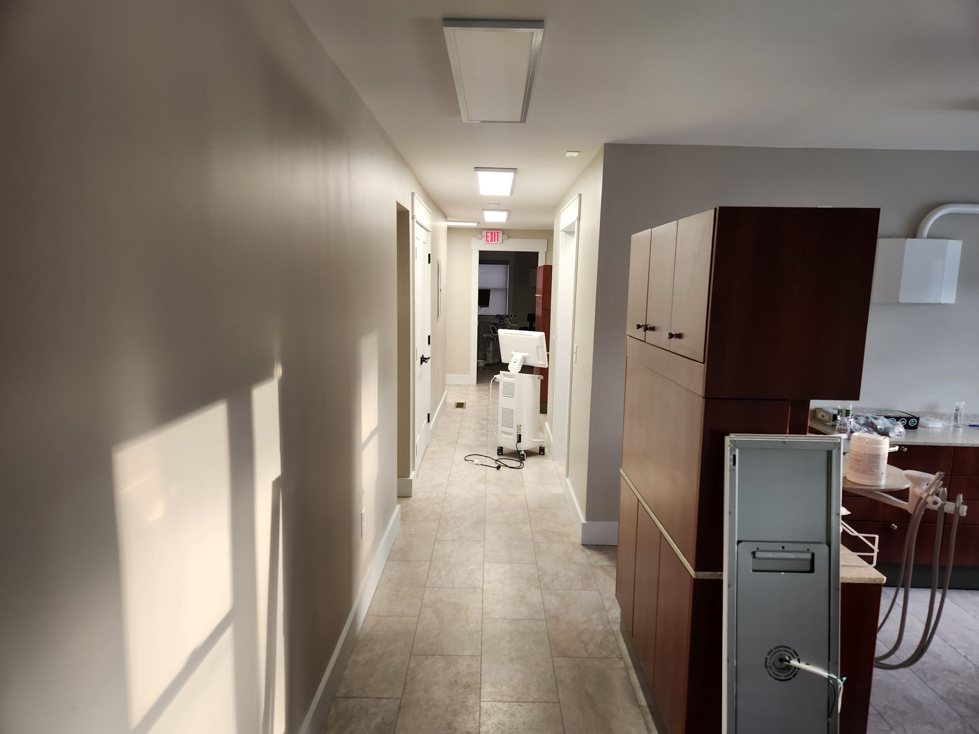 A long hallway leading to a dental office