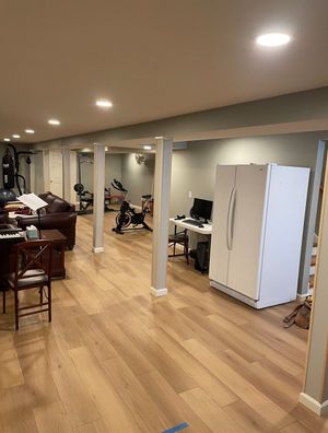 There is a refrigerator in the middle of the room.