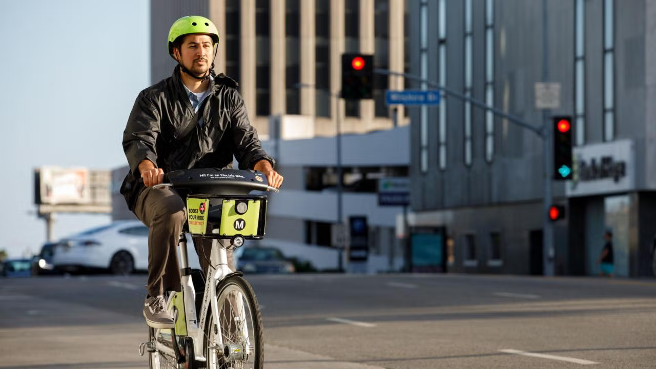 Student riding Metro bike share in Los Angeles