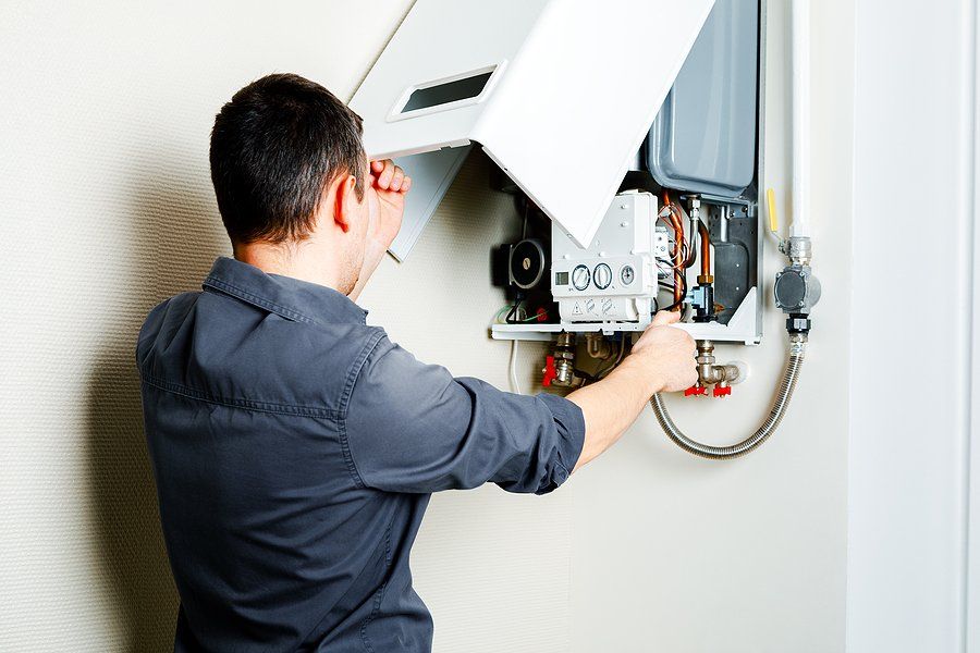 repairman checking the heater