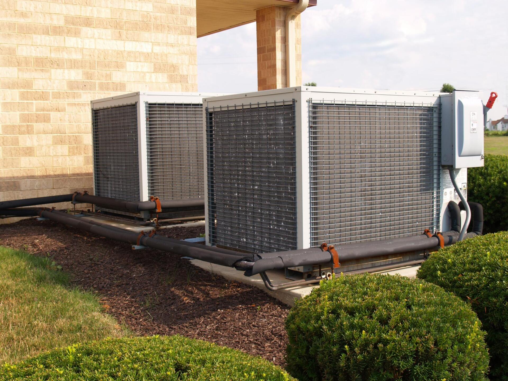 two air conditioner outside the house