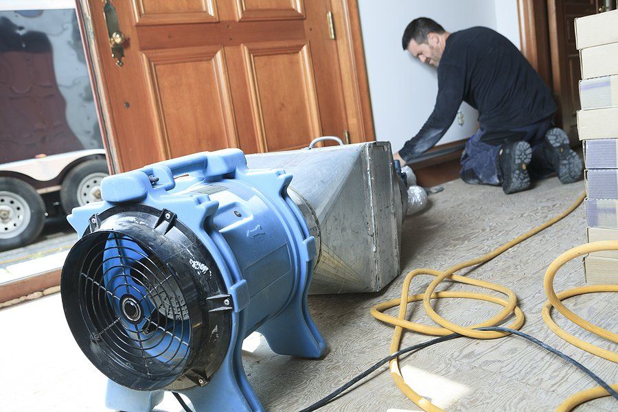worker crouching near the wall
