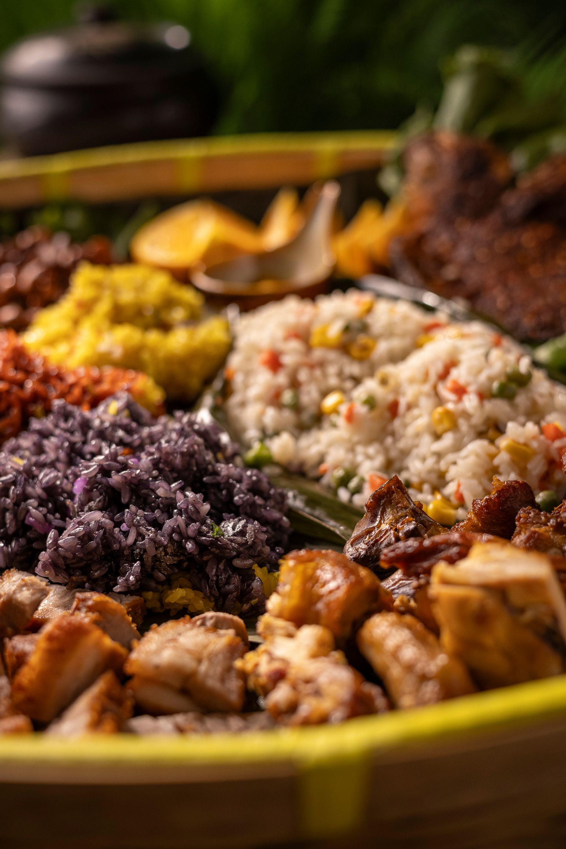 Colorful plated meal with rice, shredded purple cabbage, yellow mash, and stew in a rustic bowl