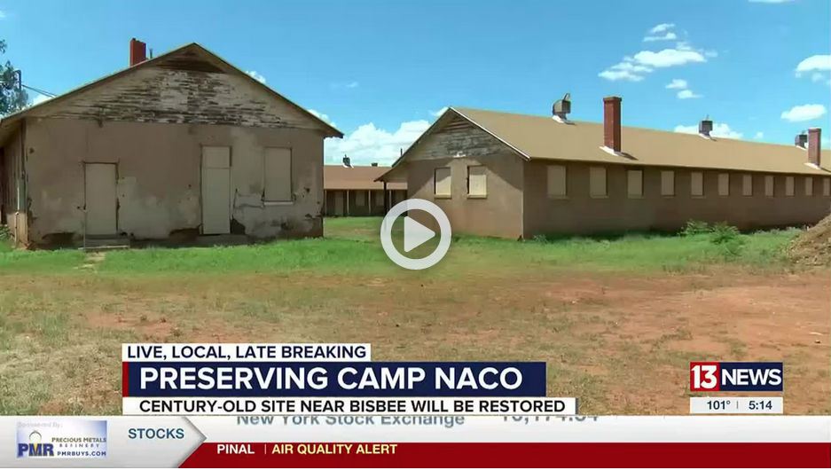 Buildings at Camp Naco, Arizona, with news banner 