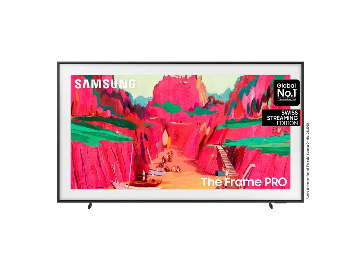 Samsung The Frame PRO TV zeigt ein abstraktes Landschaftsbild in leuchtendem Pink und Grün.