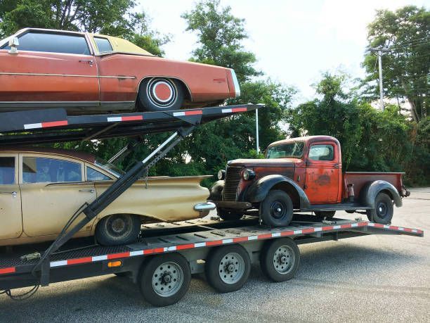 Transportation of a couple of vintage cars.
