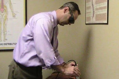 Dr. John Milham Performing Cold Laser Therapy
