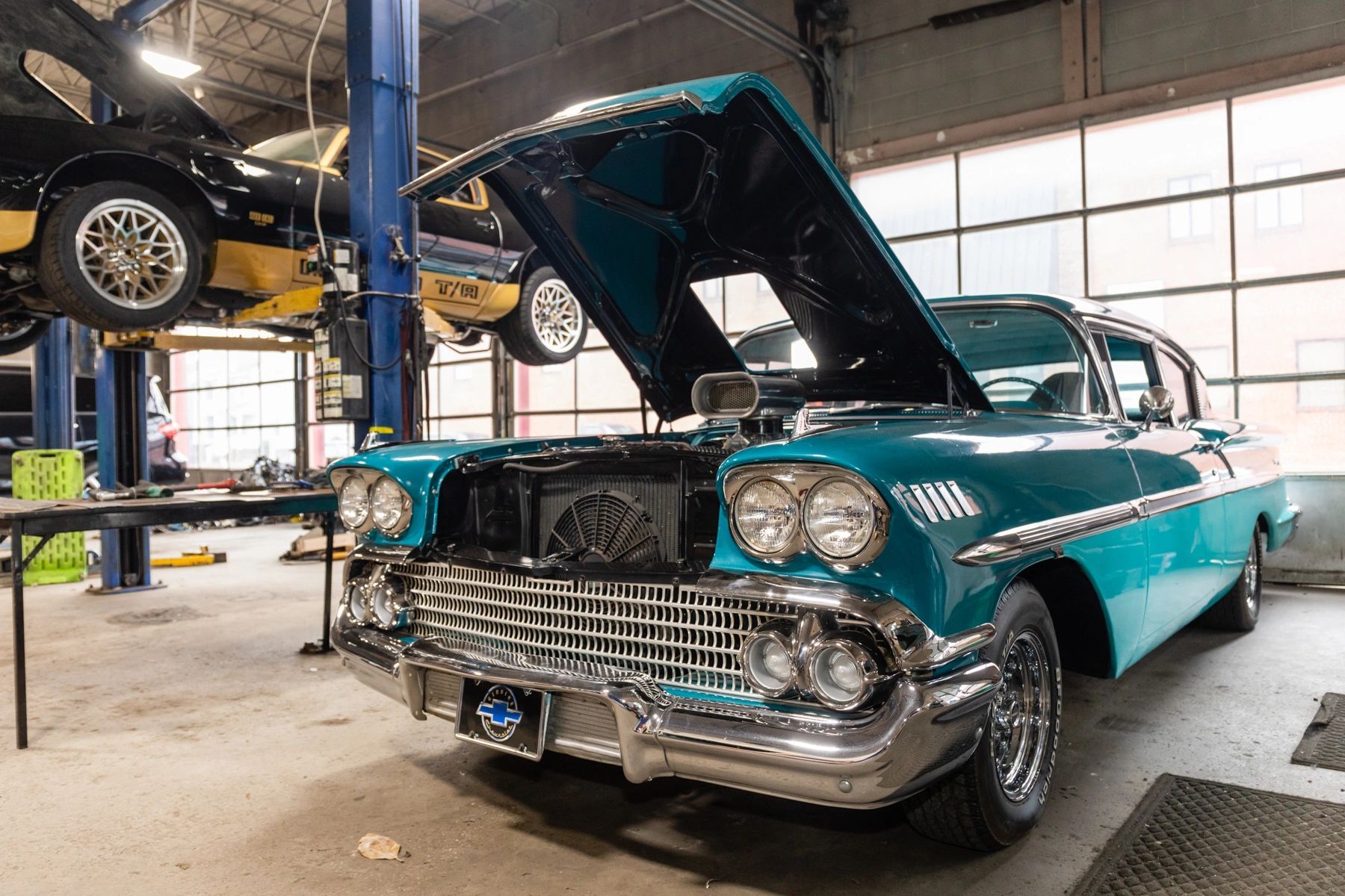 A Blue Car With the Hood Up Is Parked in a Garage | Professional Auto Repair