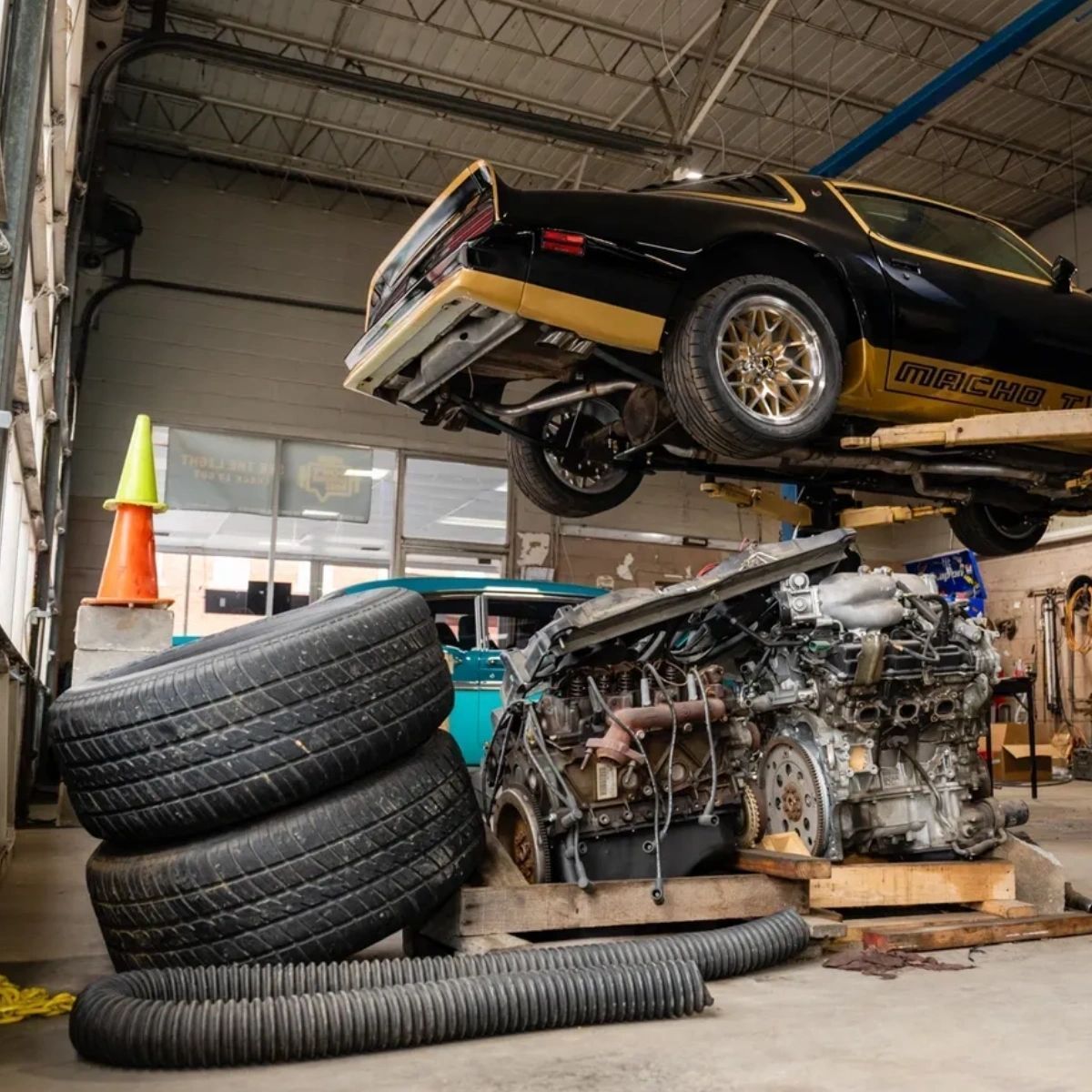 A Car Is Sitting on Top of a Stack of Tires in a Garage | Professional Auto Repair