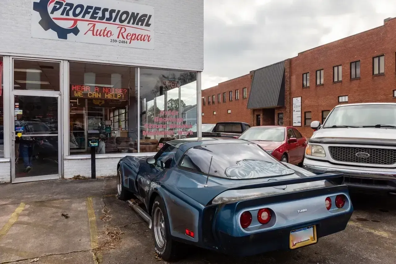 A Blue Car Is Parked in Front of a Professional Auto Repair Shop | Professional Auto Repair