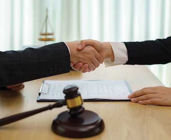 Shaking Hands — Eau Claire, WI — Law Offices Of Jeffrey Klemp LLC Shaking Hands — Eau Claire, WI — Law Offices Of Jeffrey Klemp LLC