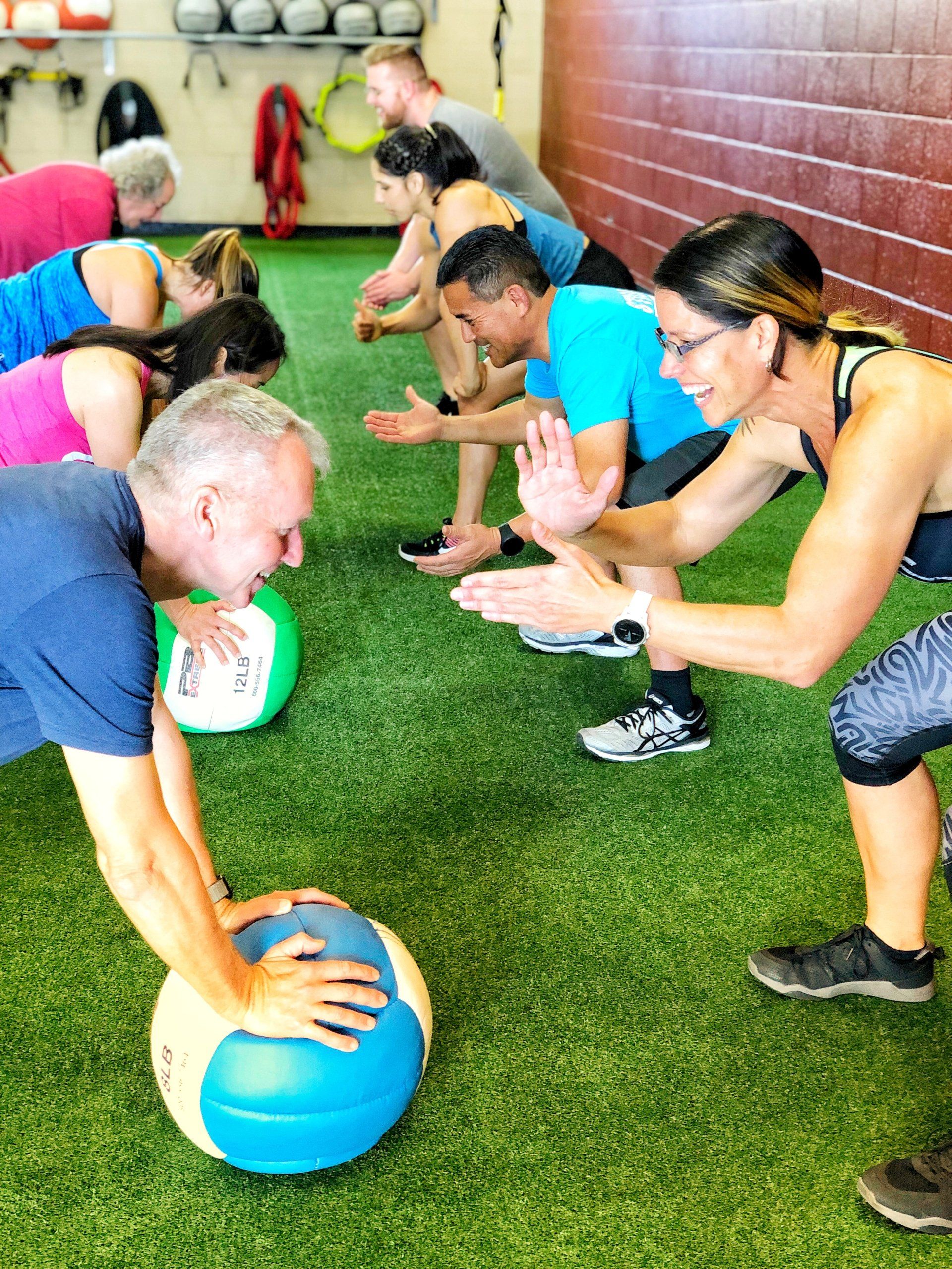group of people exercising together at results fitness