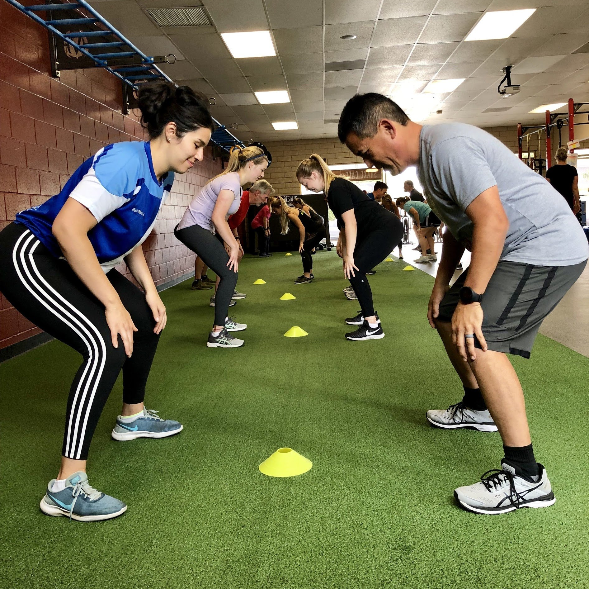 people exercising together in a class