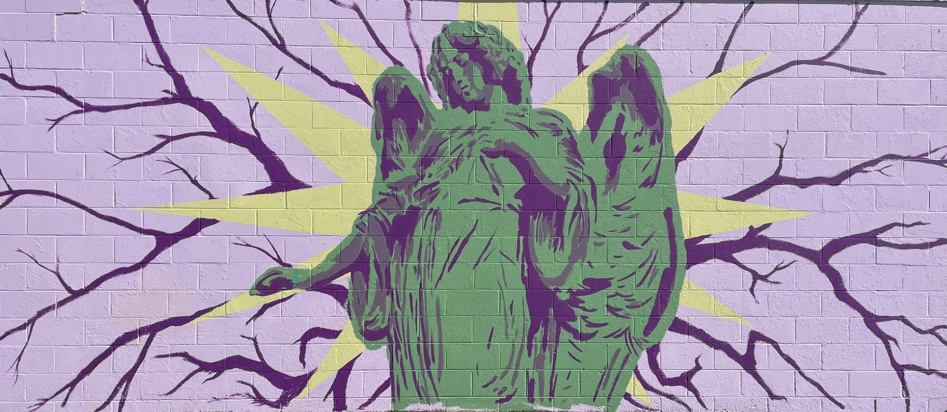Green statue against a purple cracked background, with yellow lightning-like streaks branching outward