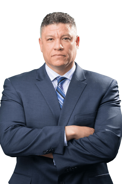 A man in a suit and tie is standing with his arms crossed. A man in a suit and tie is standing with his arms crossed.