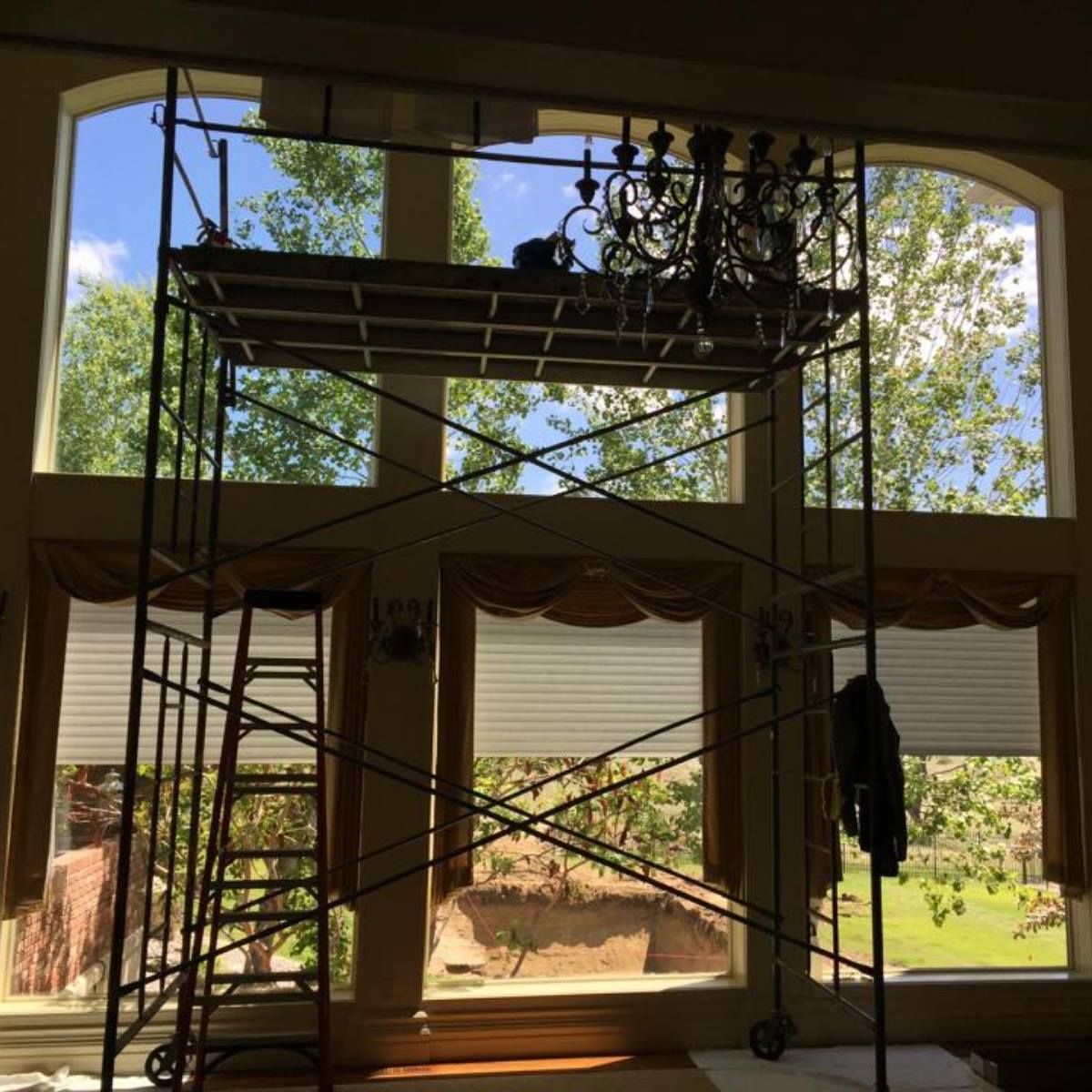 A large window with a scaffolding in front of it