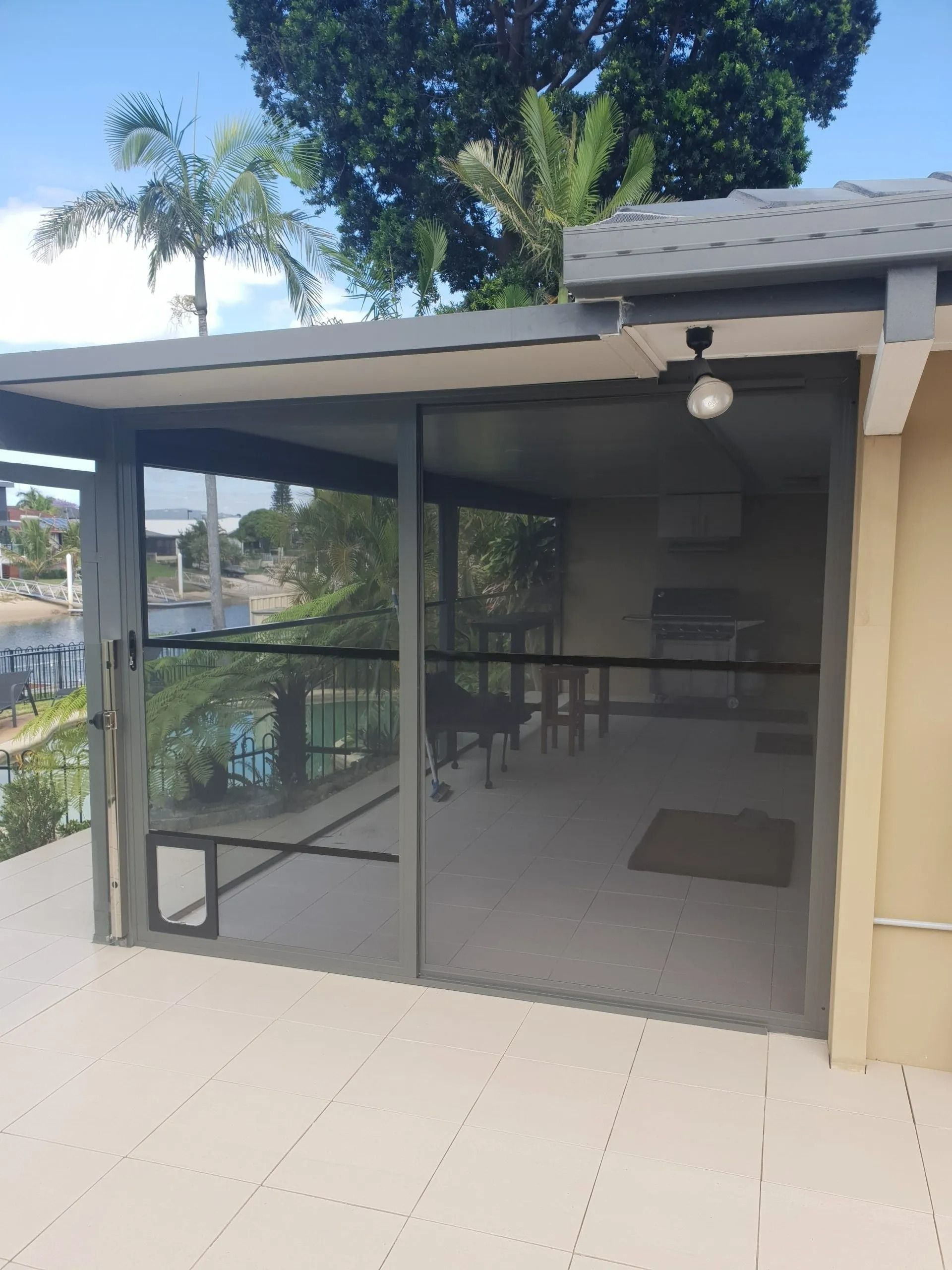 A House With a Screened in Porch and a Fence in the Background — Smart Screens Qld in Ormeau, QLD