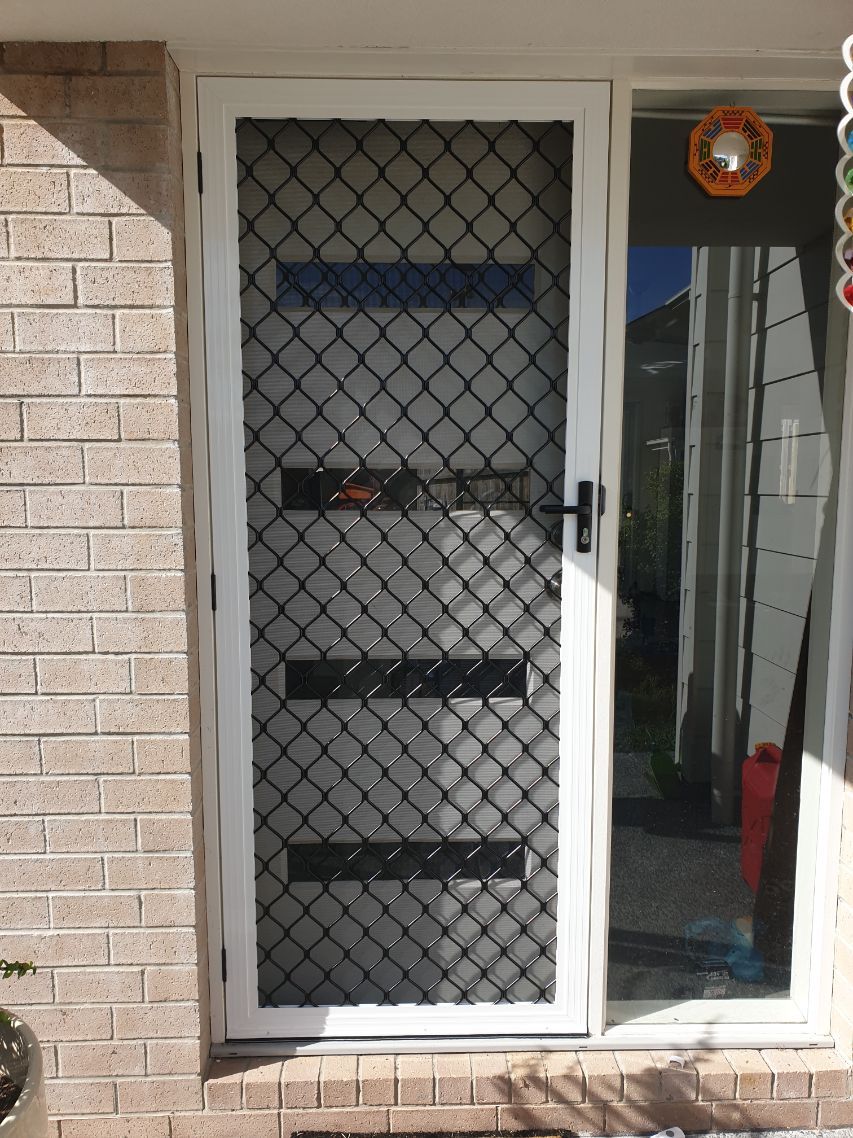 White and Black Diamond Grille Security Door  — Smart Screens Qld in Ormeau, QLD
