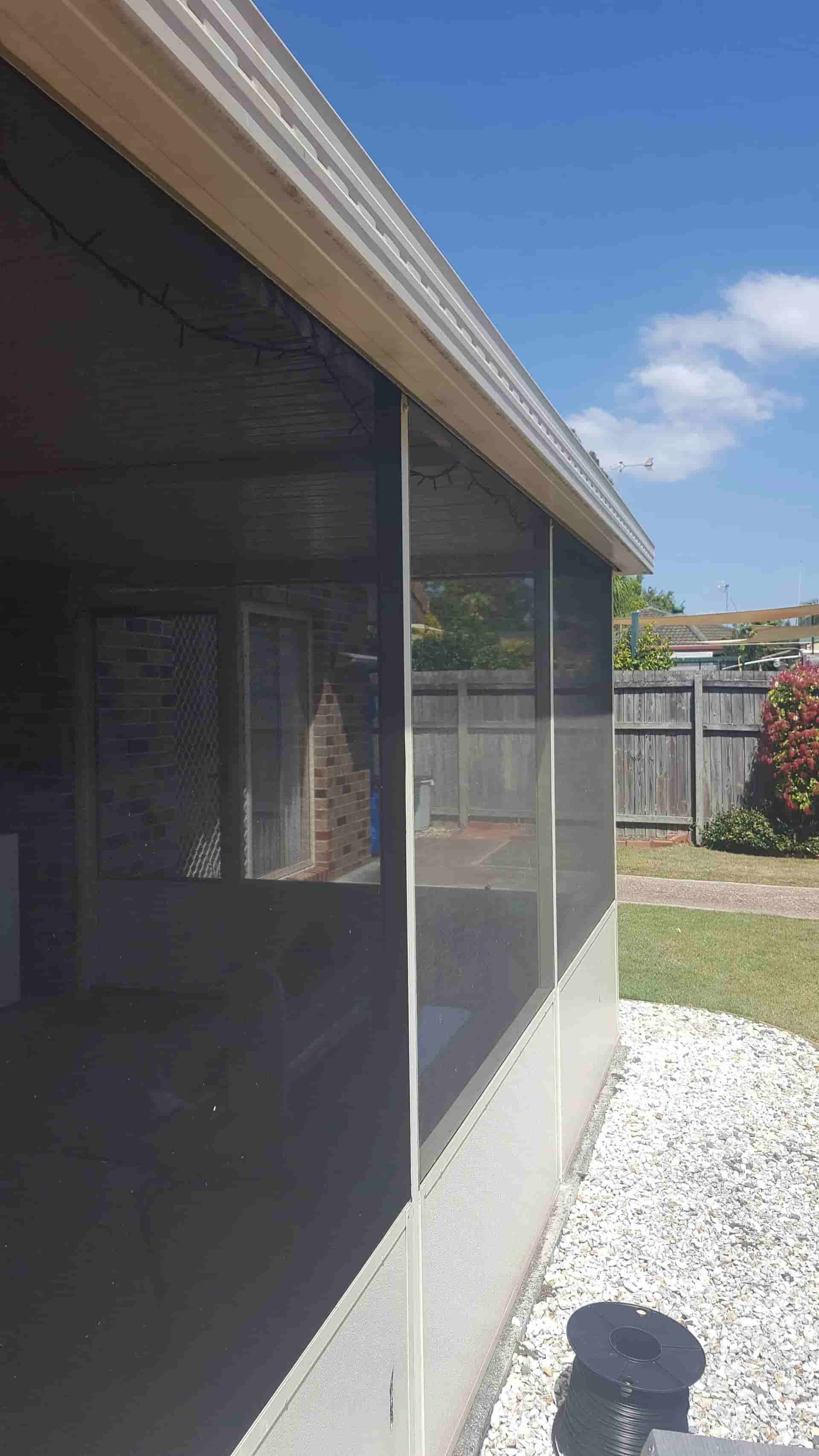 A House With a Screened in Porch and a Fence in the Background — Smart Screens Qld in Ormeau, QLD