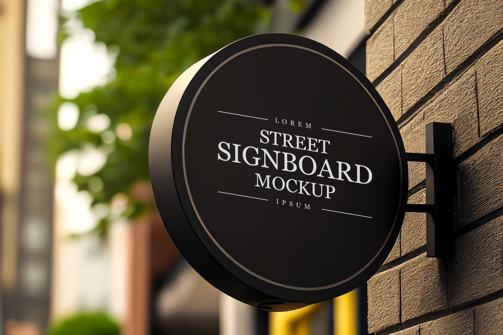 Round black blade sign mounted on brick exterior wall of a storefront building