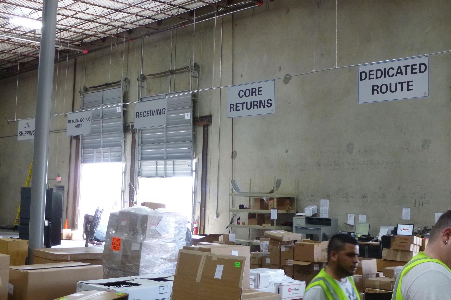 Warehouse with loading docks and signs: 