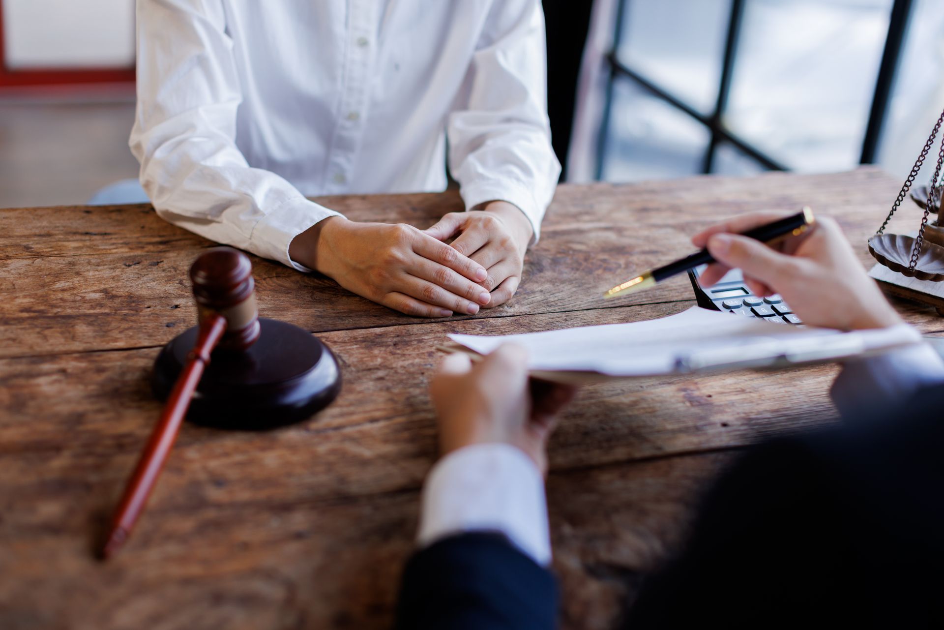 A lawyer is explaining a document to a client A lawyer is explaining a document to a client