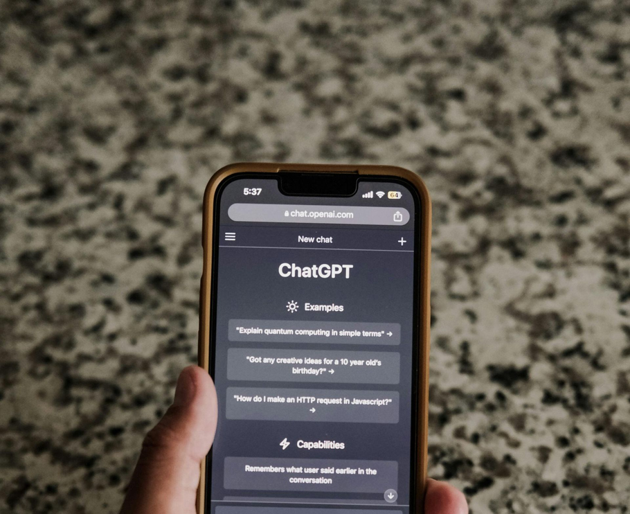 smartphone displaying ChatGPT used for AI-assisted research and decision making when considering local businesses