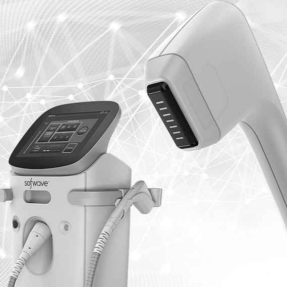 White medical laser device with touchscreen and handpiece against a light tech background
