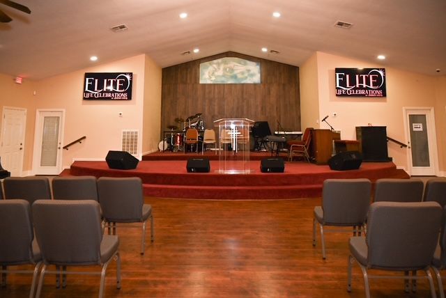 A church with a podium and a red carpet