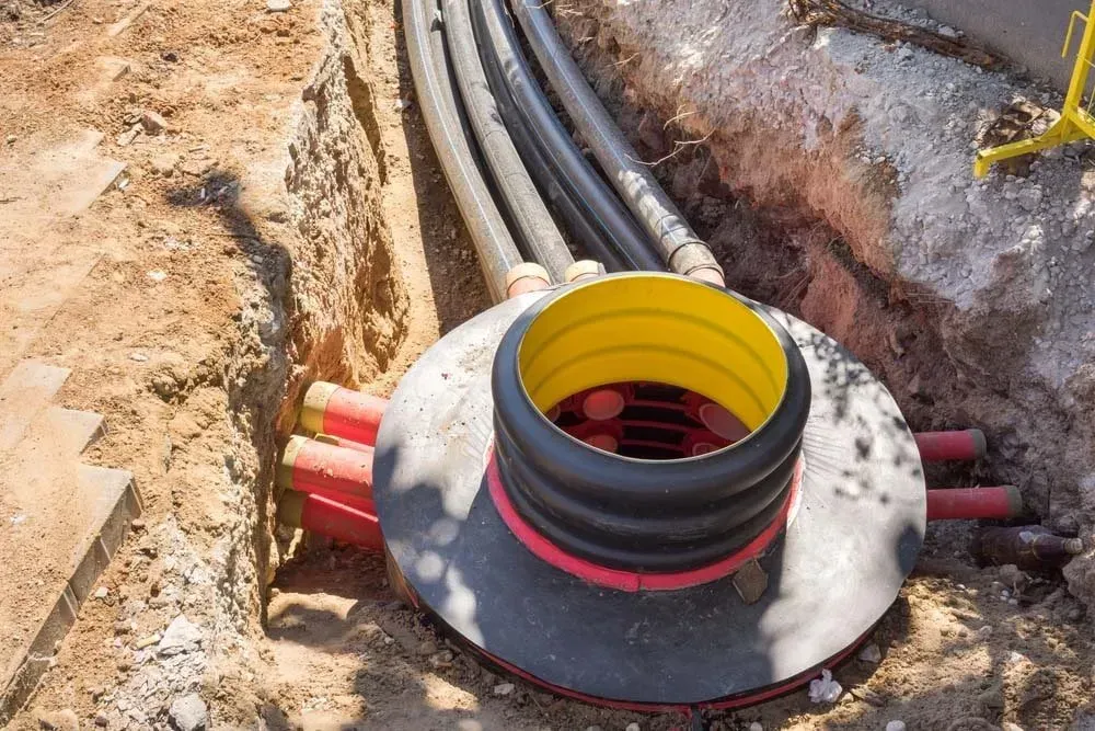 Underground Utility Work: Conduits Lead to a Manhole — Far North Plumbing in Mourilyan, QLD