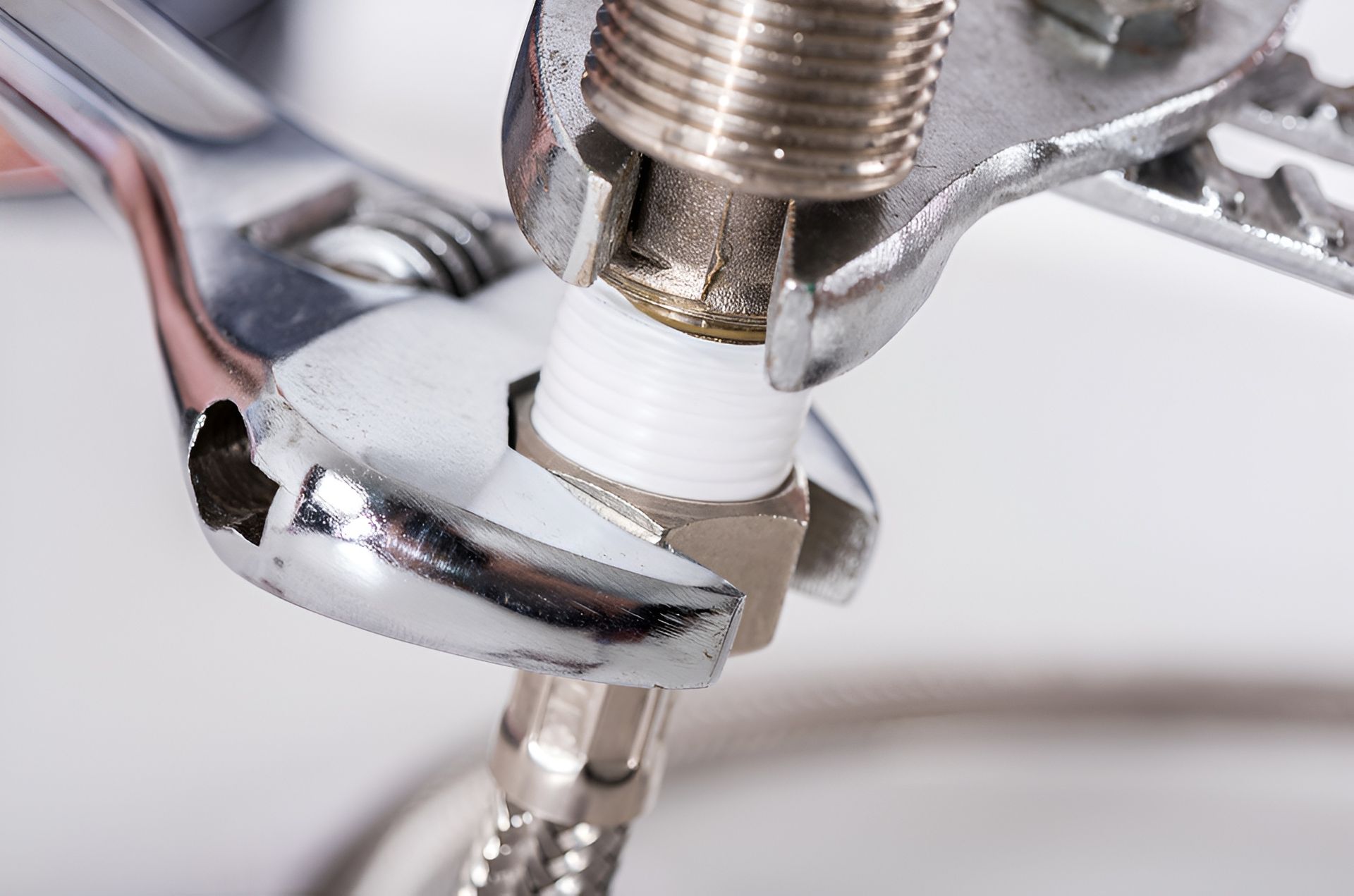 Wrenches Tightening a Fitting on a Plumbing Connection; Close-up View — Far North Plumbing in Mourilyan, QLD