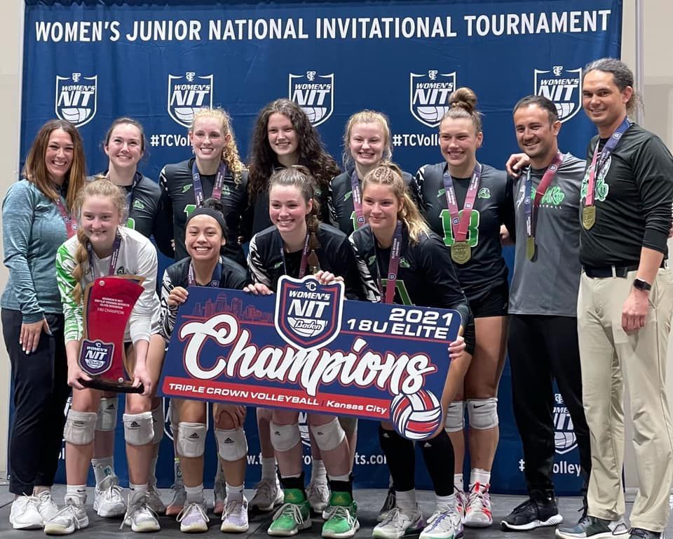 Pohaku Volleyball Club team smiling with a championship banner