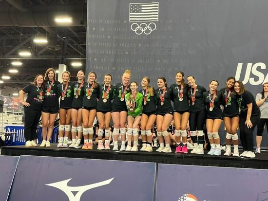 Pohaku Volleyball Club team smiling with medals