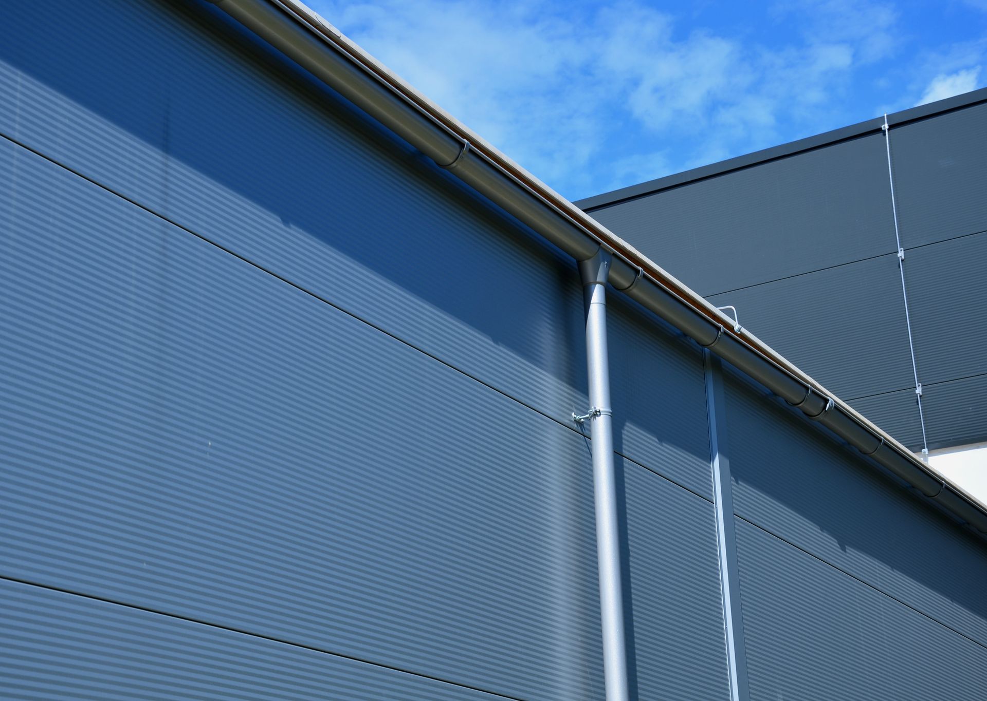 A building with a gutter on the side of it