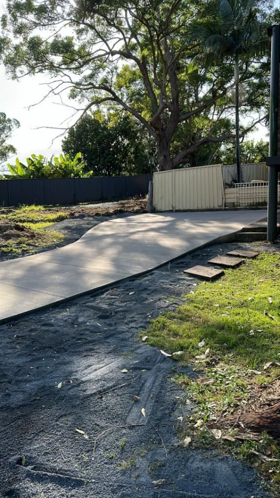A Concrete Driveway Is Being Built In The Backyard Of A House — Hinterland Concreting Pty Ltd In Lennox Head, NSW
