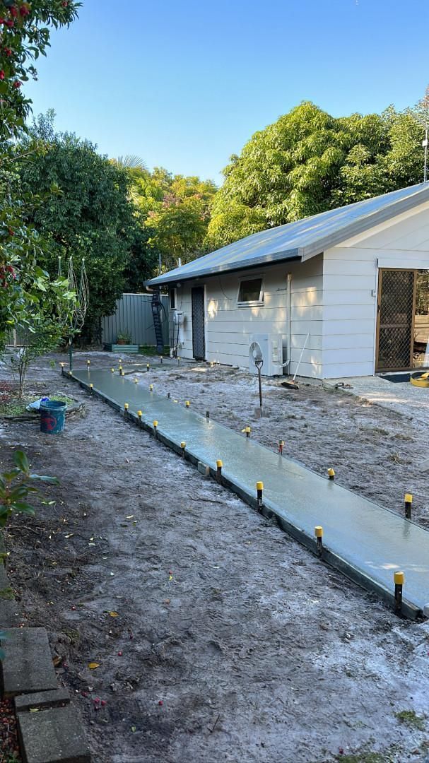 A Concrete Walkway Is Being Built In Front Of A House — Hinterland Concreting Pty Ltd In Lennox Head, NSW