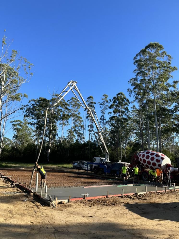 A Concrete Pump Is Being Used To Pour Concrete — Hinterland Concreting Pty Ltd In Lennox Head, NSW