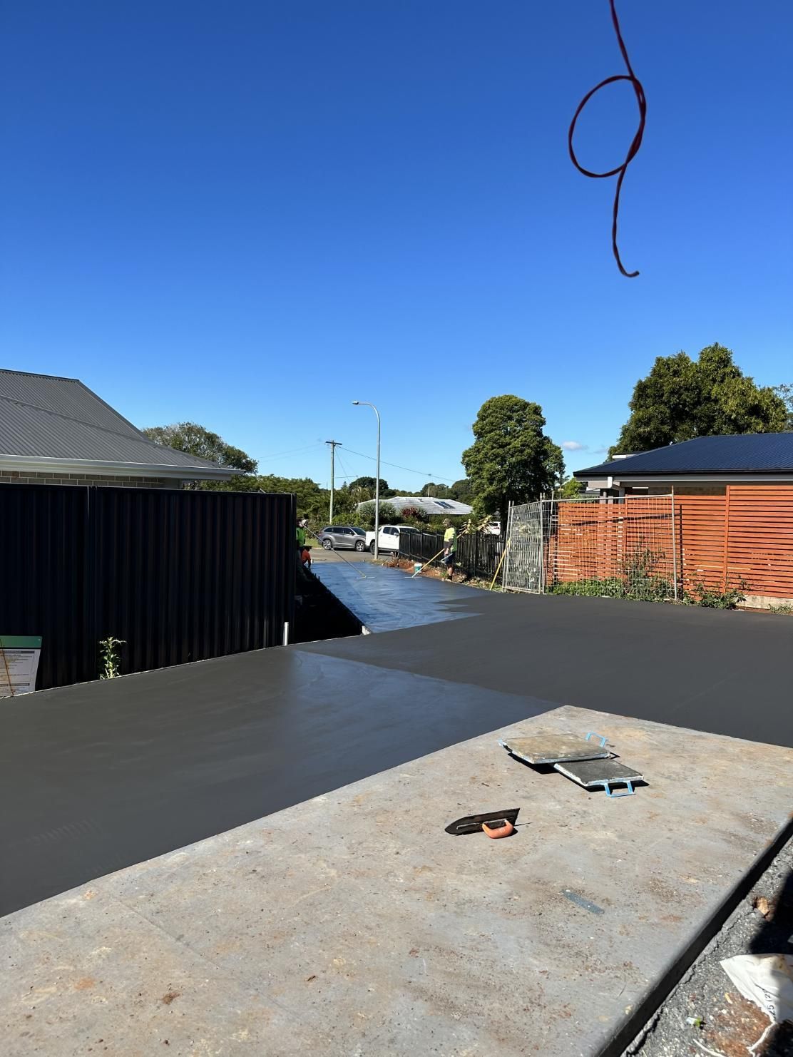 A Concrete Slab Is Sitting On The Side Of A Road — Hinterland Concreting Pty Ltd In Lennox Head, NSW