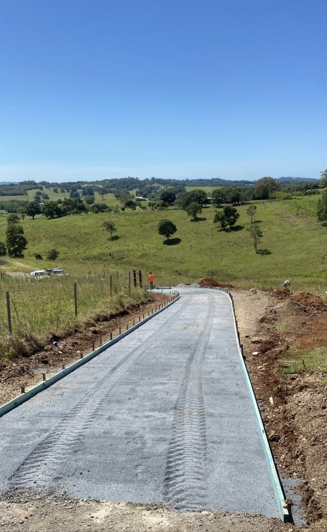 A Concrete Road Is Being Built In The Middle Of A Field — Hinterland Concreting Pty Ltd In Lennox Head, NSW