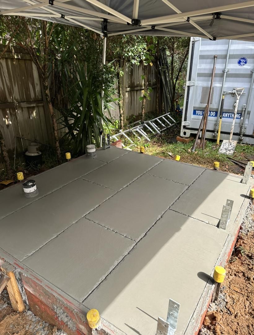 A Concrete Floor Is Being Built In A Backyard — Hinterland Concreting Pty Ltd In Lennox Head, NSW