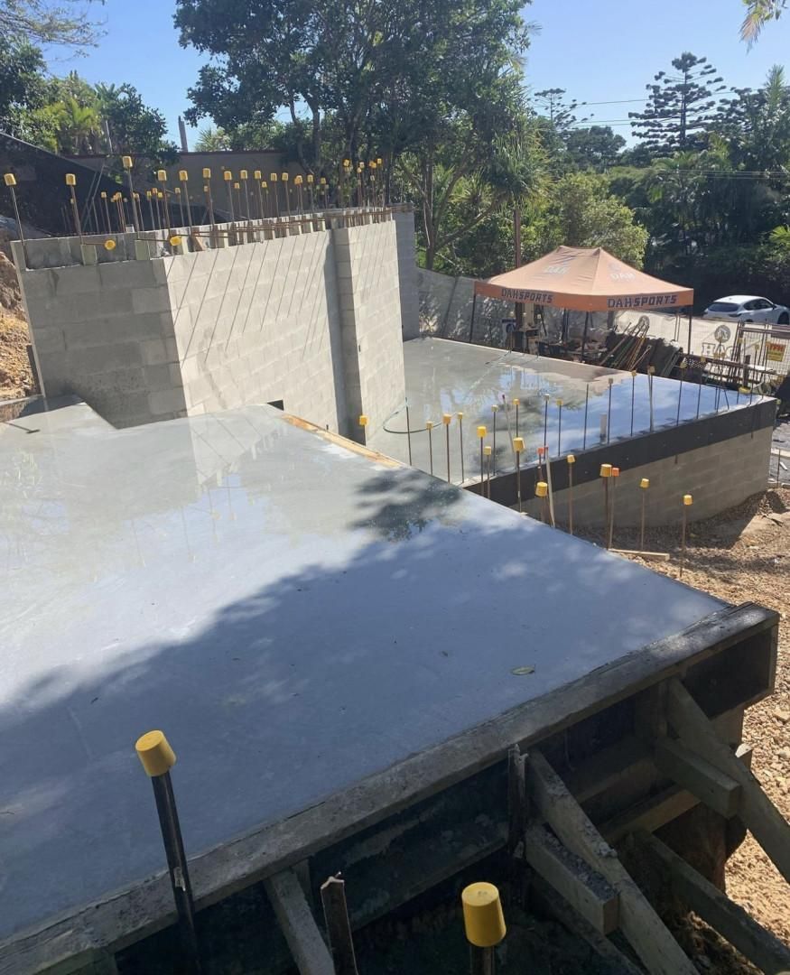 A Large Concrete Slab Is Sitting In The Middle Of A Construction Site — Hinterland Concreting Pty Ltd In Lennox Head, NSW
