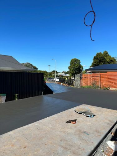 A Concrete Slab Is Sitting On Top Of A Concrete Driveway — Hinterland Concreting Pty Ltd In Kyogle, NSW