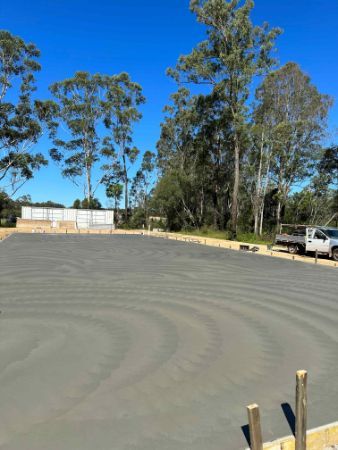 A Large Concrete Parking Lot With A Lot Of Trees In The Background — Hinterland Concreting Pty Ltd In Murwillumbah, NSW