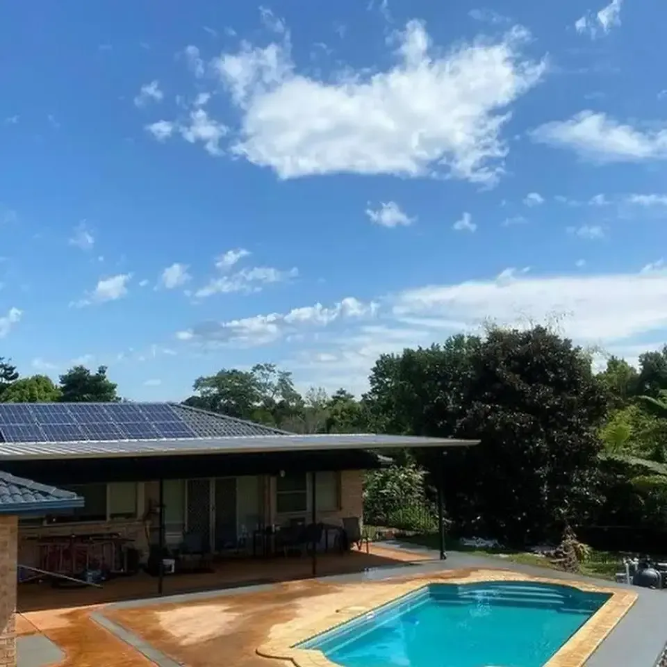 A house with a swimming pool and solar panels on the roof — Hinterland Concreting Pty Ltd In Lennox Head, NSW