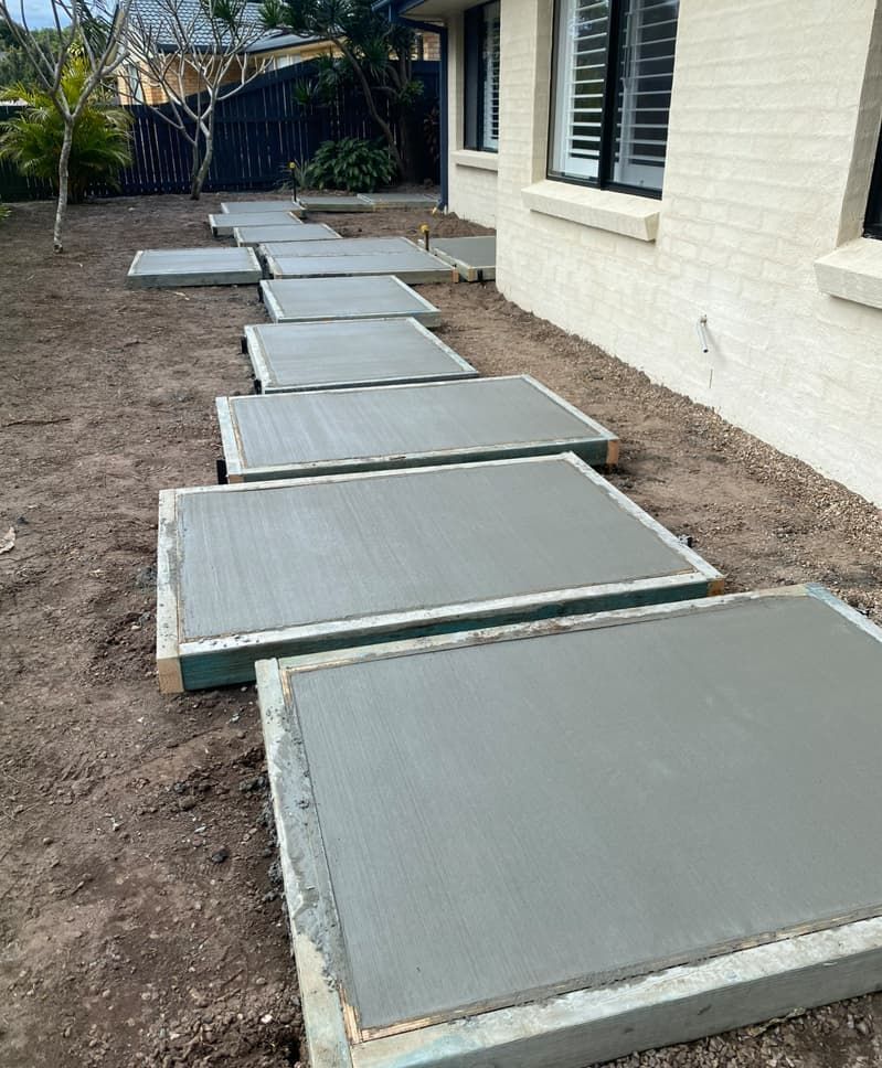 A Concrete Walkway Is Being Built In Front Of A House — Hinterland Concreting Pty Ltd In Lennox Head, NSW