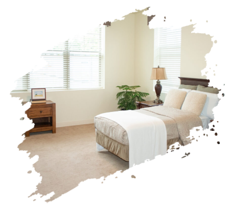 Bedroom with bed, nightstand, window with blinds, and a lamp.