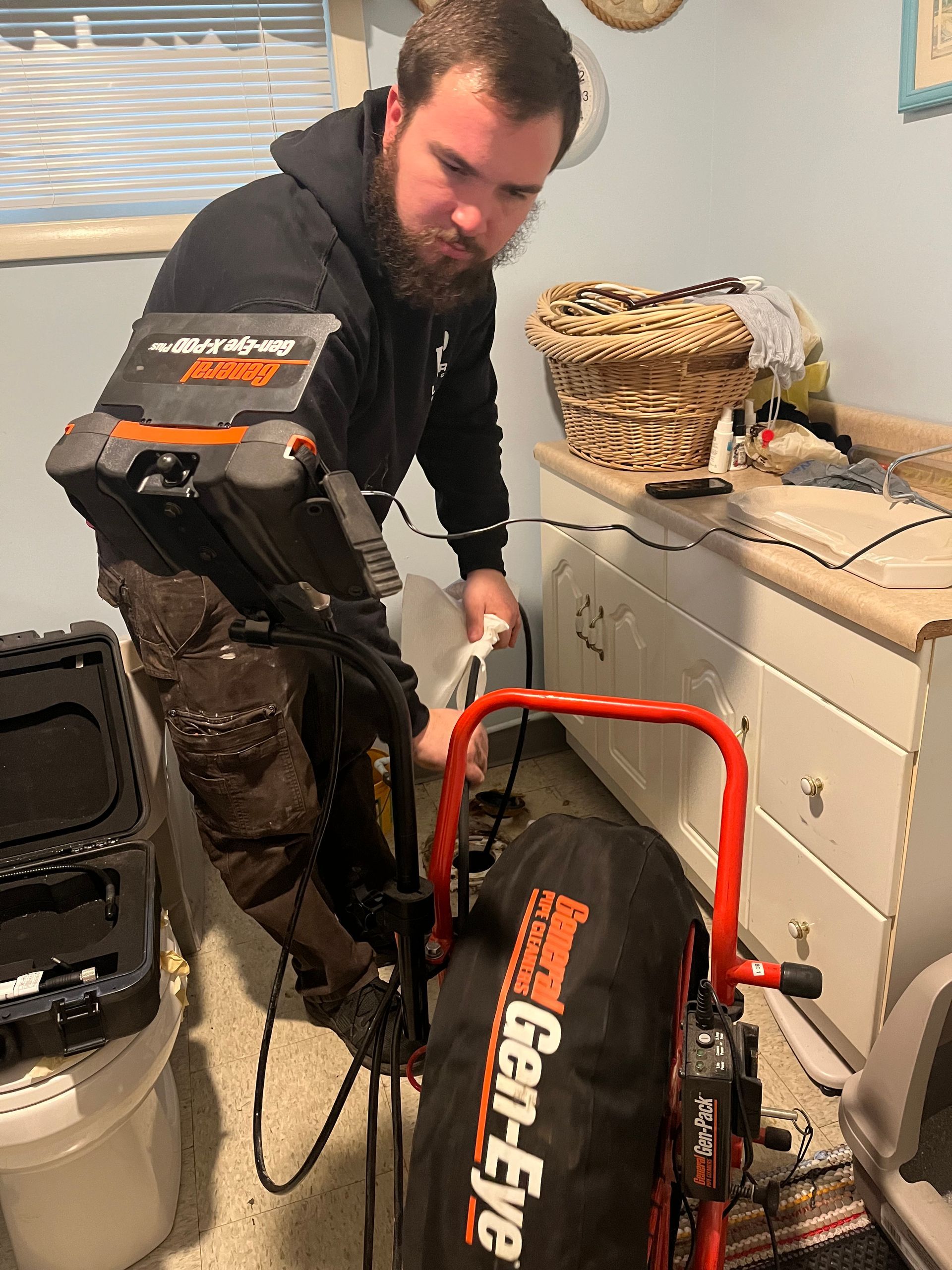 a man is standing next to a machine in a room .
